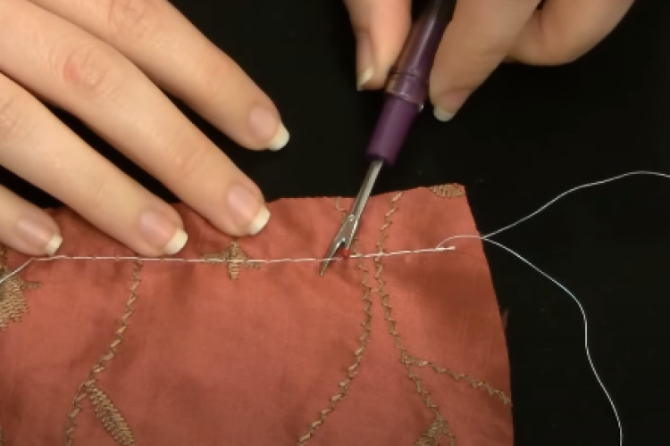Utilizing a Seam Ripper on the Wrong Side of the Fabric Utilizing a Seam Ripper on the Wrong Side of the Fabric